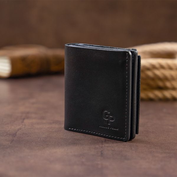 Вертикальне глянсове портмоне з накладною монетницьою GRANDE PELLE 11329 Чорне 11329 фото